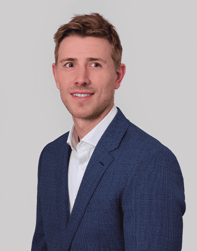 Experienced finance professional in a tailored suit, representing Gresham House's expertise in investment management and sustainable asset classes in the UK.