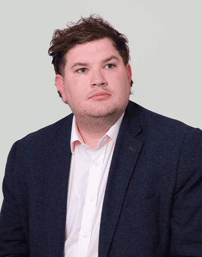 Professional male executive, close-up portrait at Gresham House, investment management, business leadership, professional services, corporate environment, financial expertise.