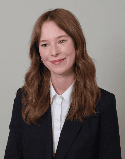 Innovative woman in professional attire, representing Gresham House's investment expertise and focus on sustainable growth and alternative asset management.