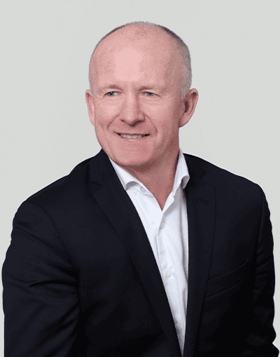 Experienced businessman in a tailored suit representing Gresham House, a leading investment management firm specialising in alternative assets and sustainable investments.