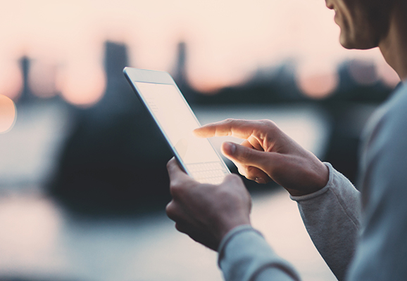 Man typing on a iPad