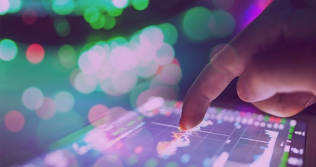 Closeup of Hand Pointing at Glowing Business Chart