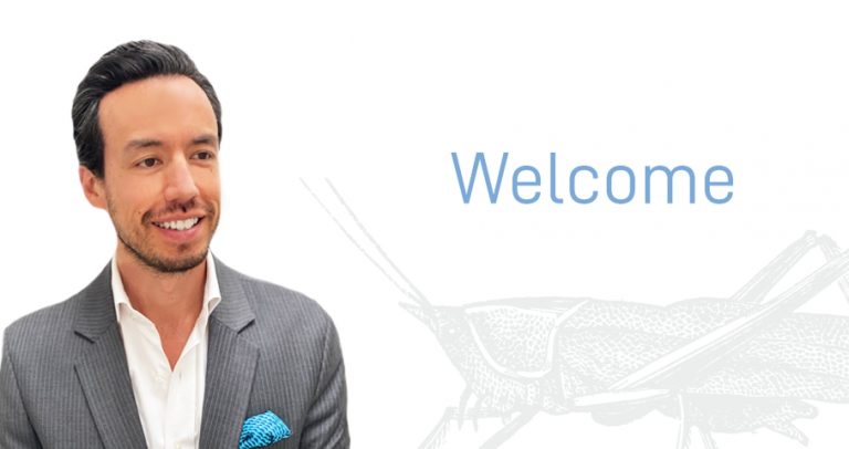 Peter Bachman and "welcome" sign