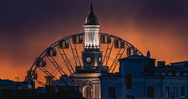 A city clock in the sunset