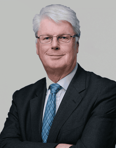 Experienced financial professional in a business suit, representing Gresham House's investment management and sustainable asset strategies.