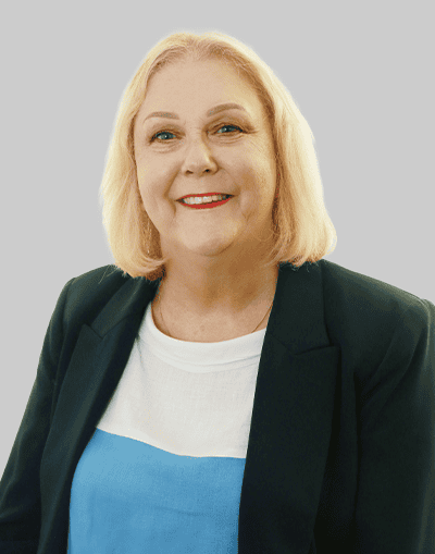 Professional woman in business attire representing Gresham House investment firm, smiling confidently.