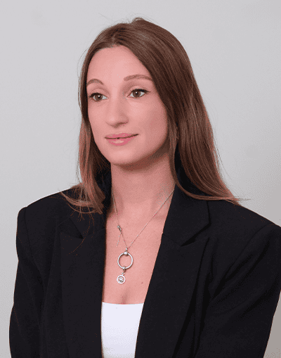 Professional woman in business attire representing Gresham House, an investment management firm specialising in sustainable and alternative investments.